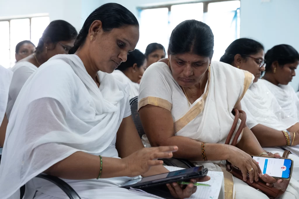 ANMs participating in training sessions, using tablets/mobile devices